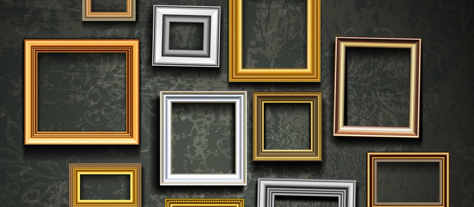 A series of empty frames, stylishly displayed on dark-toned flocked wallpaper.