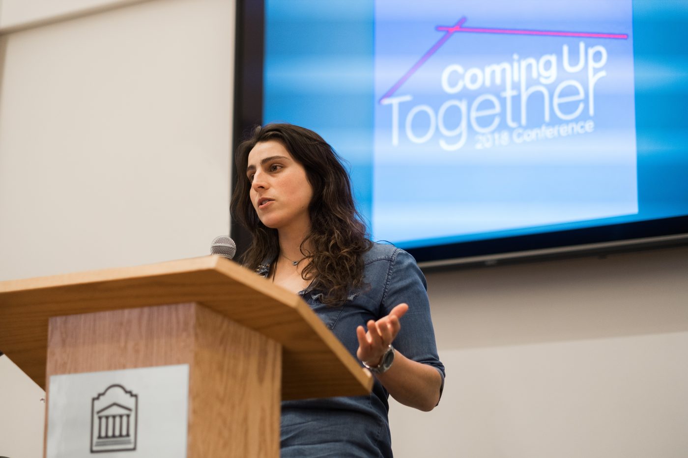Charlotte Smith in front of a podium