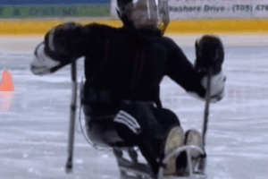 Sledge hockey player in action