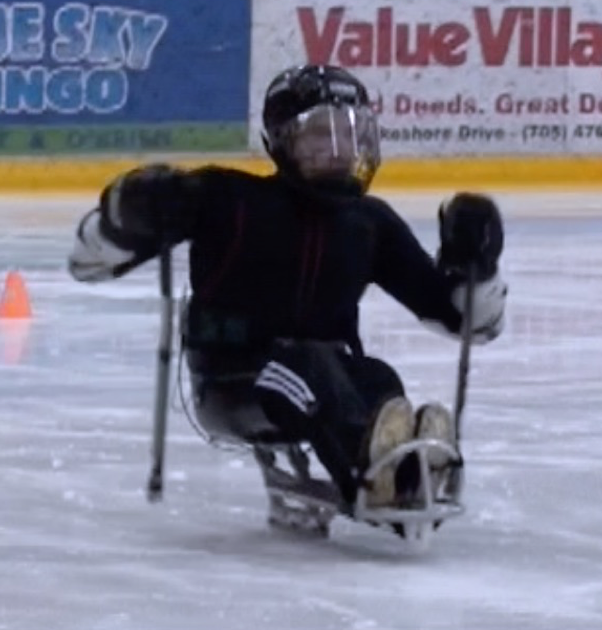 Sledge hockey player in action