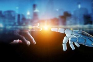 cyborg hand touching a human hand