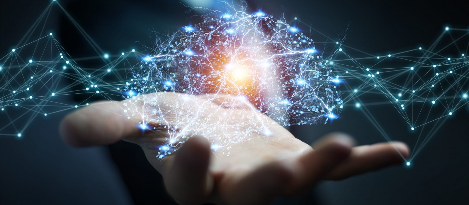 A 3-d simulation of a series of nodal networks being held in the palm of a person's hand