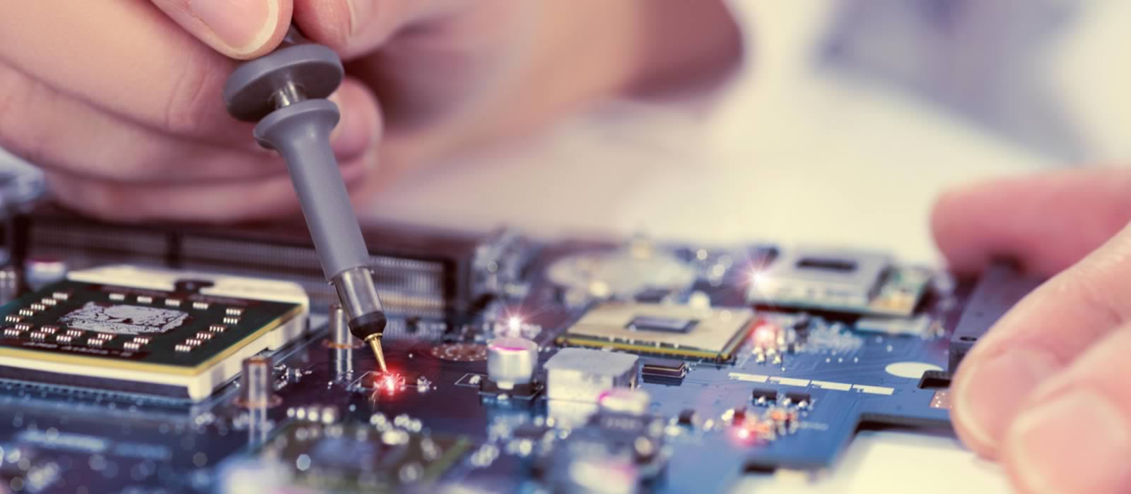 Engineer working on circuit board