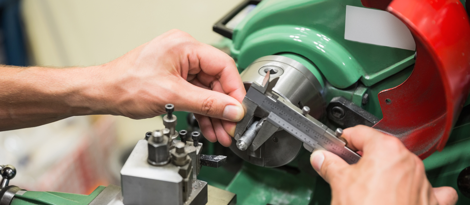 Mechanical engineer, using precise, measurement, tools to calibrate machine
