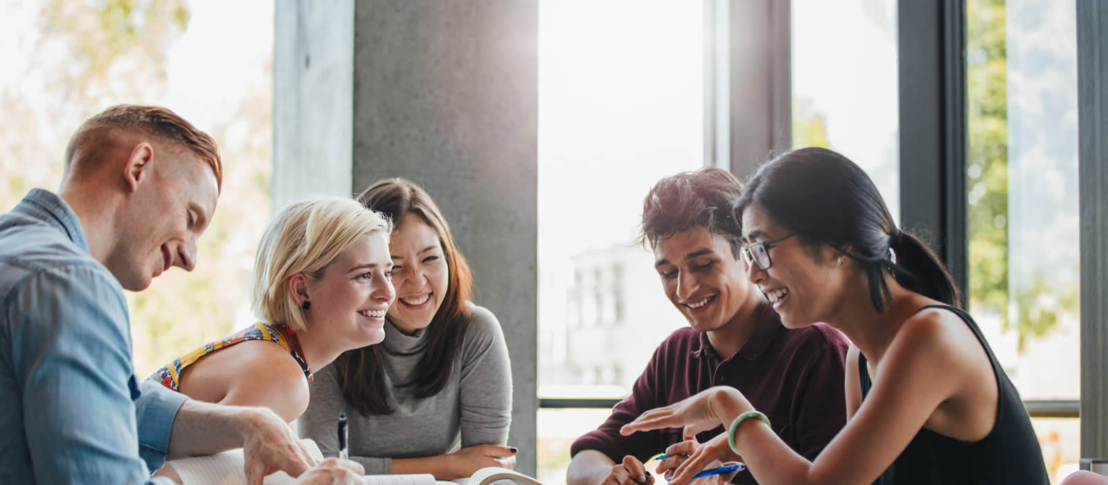 Group of students discussing a book