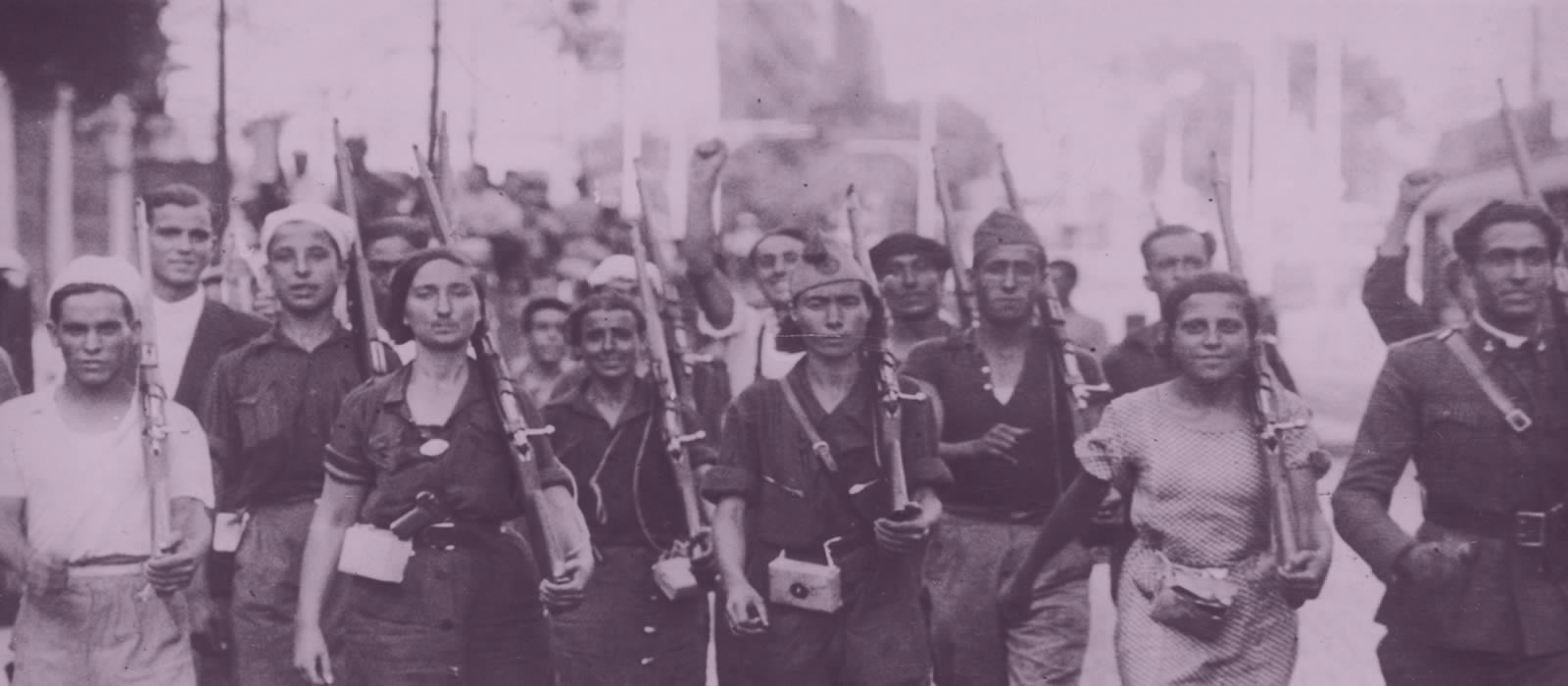Historical image showing group of people marching with rifles