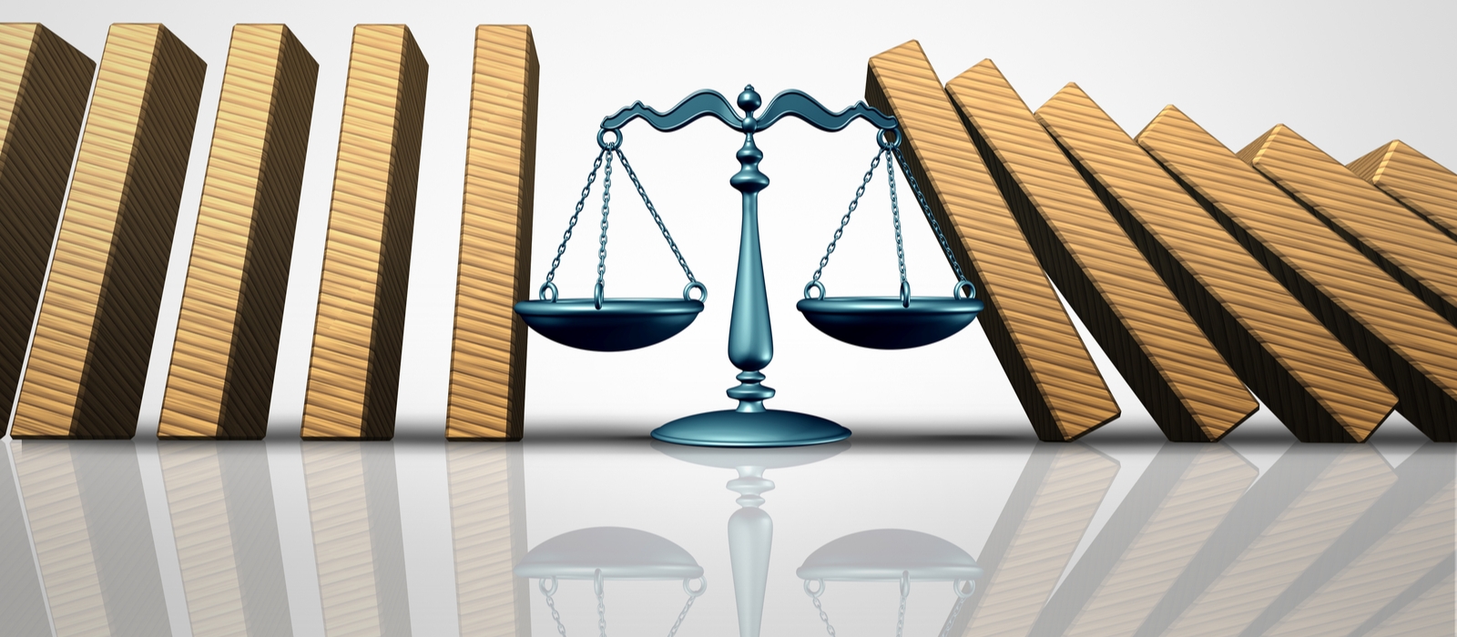 Scales of justice between gold bars