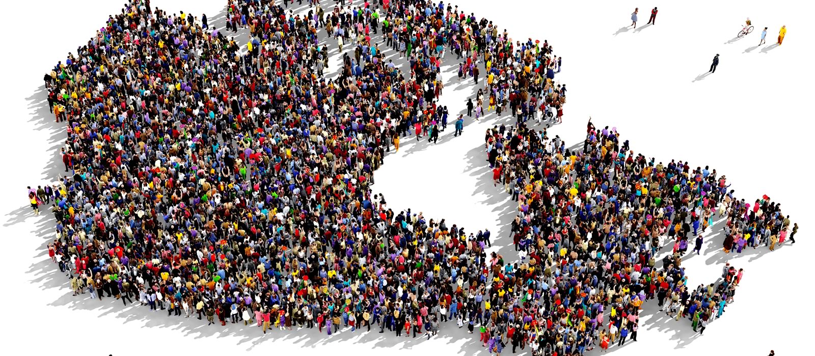 A large group of people standing in forming the shape of the country of Canada